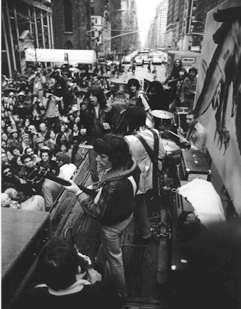 Stones playing on a flatbed truck